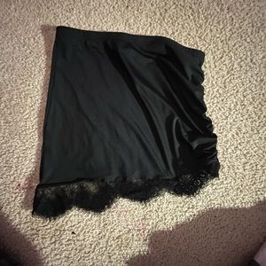 Black skirt with lace trimming.